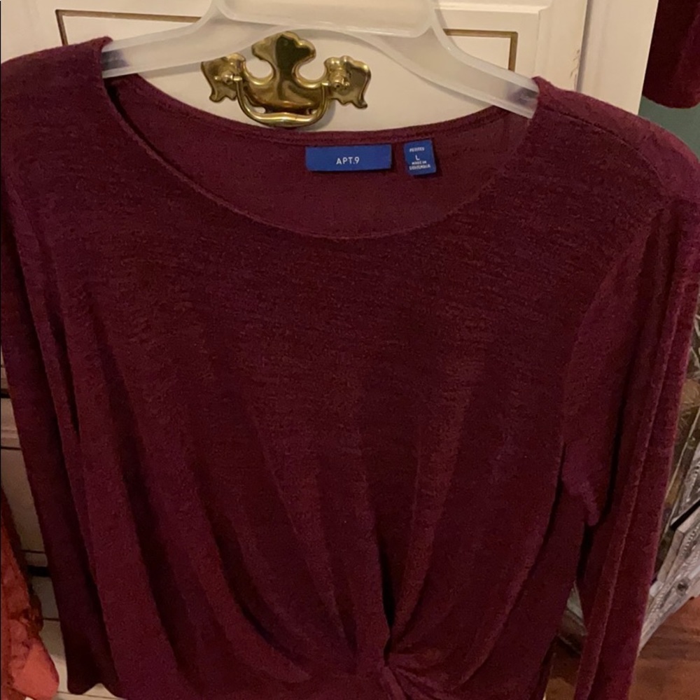 Long sleeved dark plum colored shirt